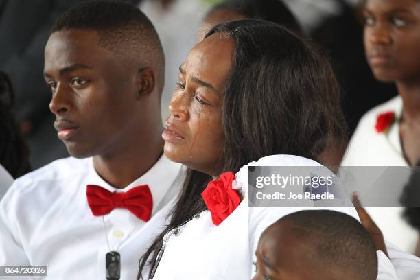 Richard Johnson, jr and Cowanda Jones-Johnson attend the burial service for her son U.S. Army Sgt. La David Johnson at the Memorial Gardens East...