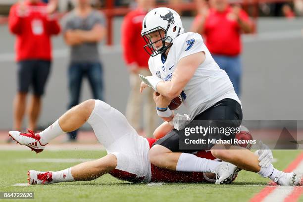 Brad Koenig of the Miami Ohio Redhawks sacks Kyle Vantrease of the Buffalo Bulls during the first half at Yager Stadium on October 21, 2017 in...