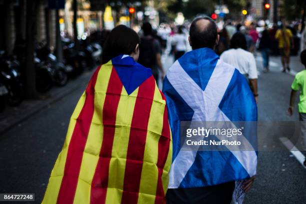 Scotland and Catalan independent flag during the 450,000 protesters rally in Barcelona against the arrest of President of the Omnium Cultural Jordi...