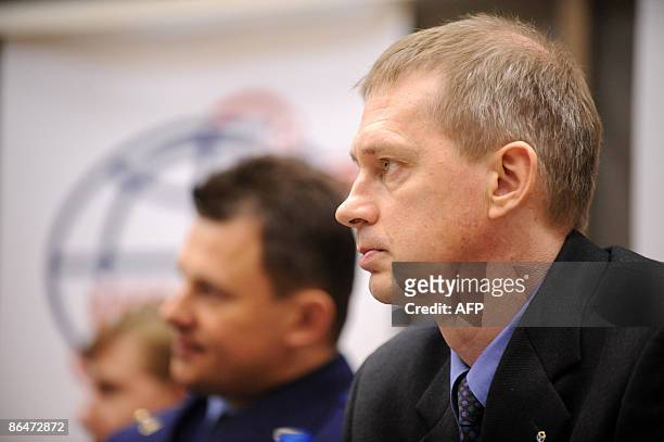 European Space Agency astronaut Frank De Winne of Belgium and Russian cosmonaut Roman Romanenko attend a press conference outside Moscow in Star City...