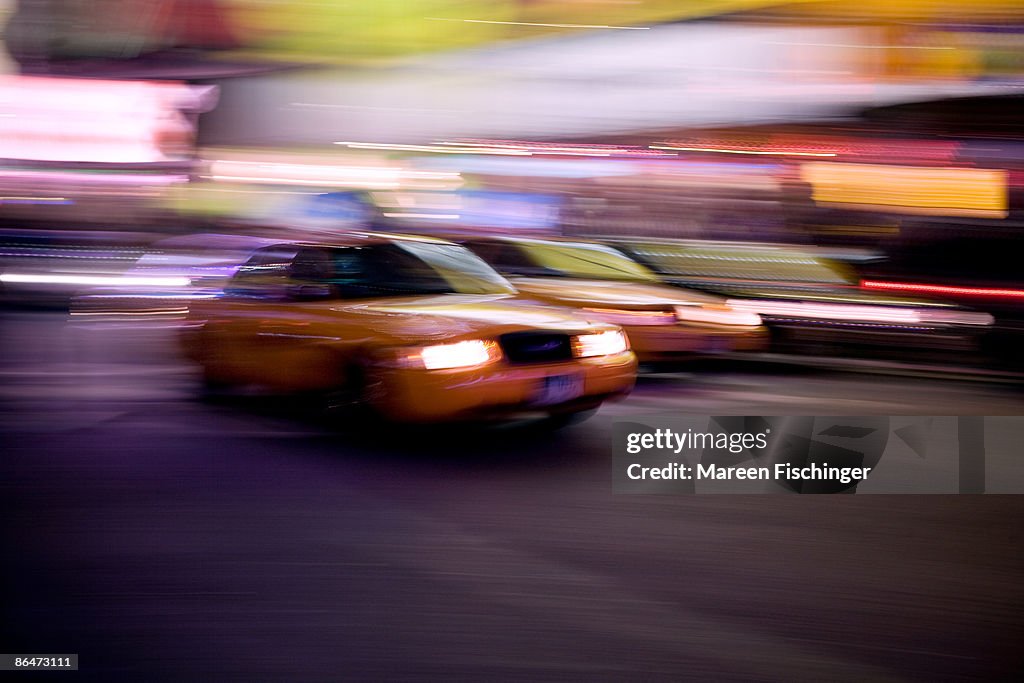 Fast moving NYC taxi with motion blur