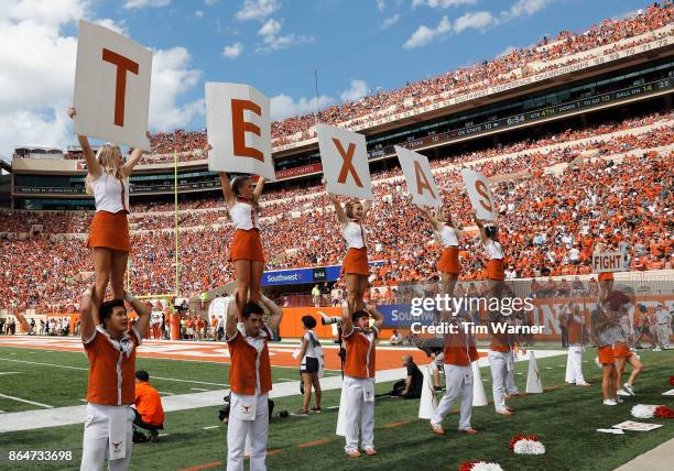 The Texas Longhorns cheerleaders perform during the game against the Oklahoma State Cowboys at Darrell K Royal-Texas Memorial Stadium on October 21,...