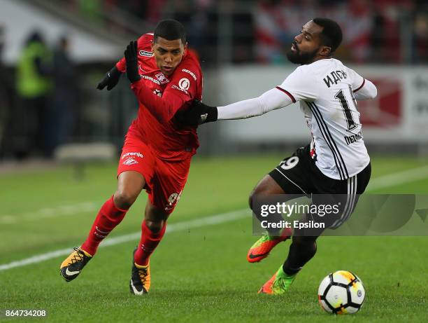 Pedro Rocha of FC Spartak Moscow vies for the ball with Brian Idowu of FC Amkar Perm during the Russian Premier League match between FC Spartak...