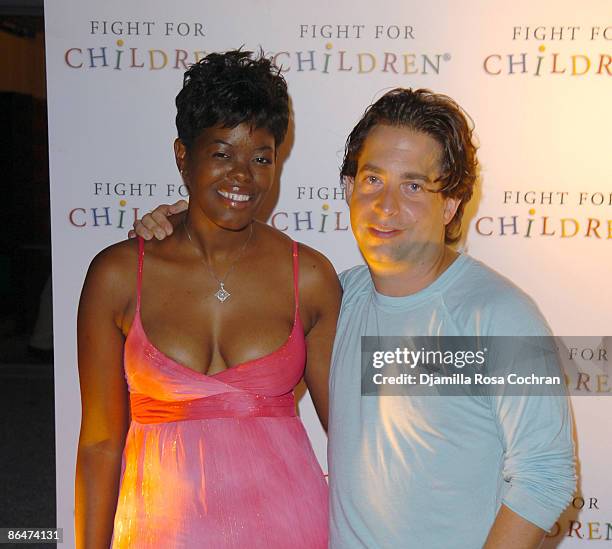 Tina Wells and Charlie Walk, President of Epic Records