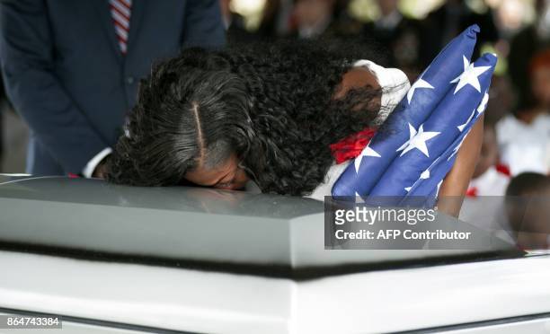 Myeshia Johnson kisses the casket of her husband Army Sgt. La David Johnson during his burial service for at the Memorial Gardens East cemetery on...