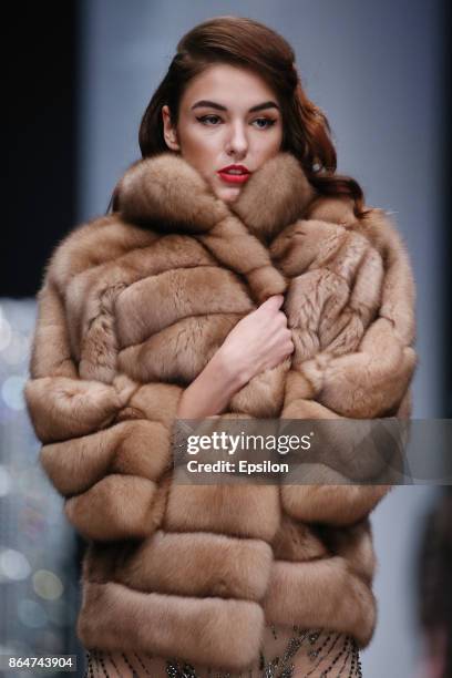 Model walks the runway at the Julia Dilua fashion show during day one of Mercedes Benz Fashion Week Russia S/S 2018 at Manege on October 21, 2017 in...