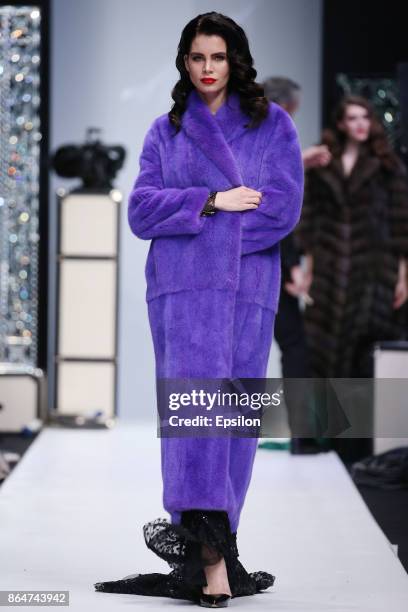 Model walks the runway at the Julia Dilua fashion show during day one of Mercedes Benz Fashion Week Russia S/S 2018 at Manege on October 21, 2017 in...