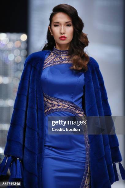 Model walks the runway at the Julia Dilua fashion show during day one of Mercedes Benz Fashion Week Russia S/S 2018 at Manege on October 21, 2017 in...