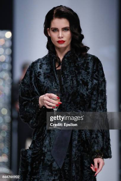 Model walks the runway at the Julia Dilua fashion show during day one of Mercedes Benz Fashion Week Russia S/S 2018 at Manege on October 21, 2017 in...