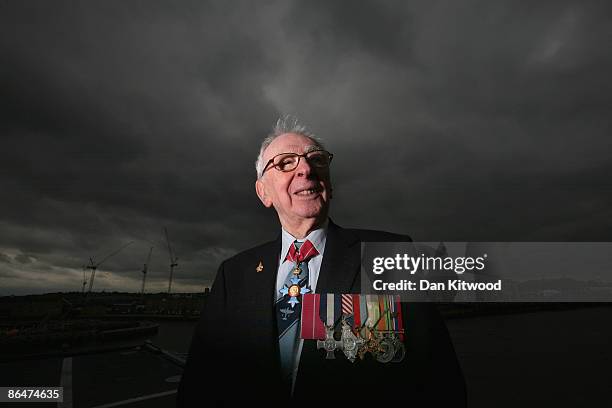 Former Royal Naval test pilot Captain Eric Brown poses for a photo aboard the HMS Illustrious on May 7, 2009 in London, England. Mr Brown flew with...