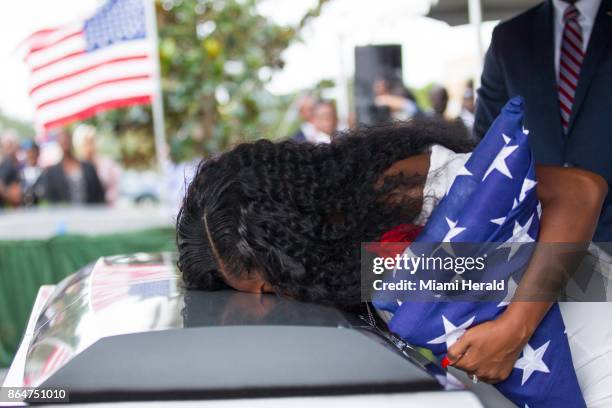 Myeshia Johnson kisses the casket of her husband, Sgt. La David Johnson, during his burial service at Fred Hunter's Hollywood Memorial Gardens in...