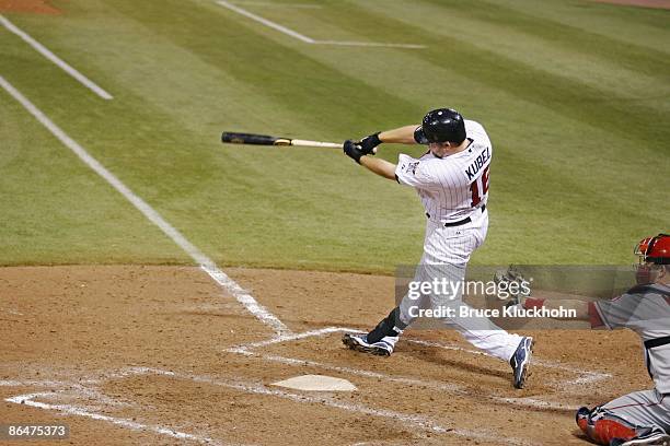 Jason Kubel of the Minnesota Twins hits a grand slam home run to complete the cycle in the eighth inning against the Los Angeles Angels at the...