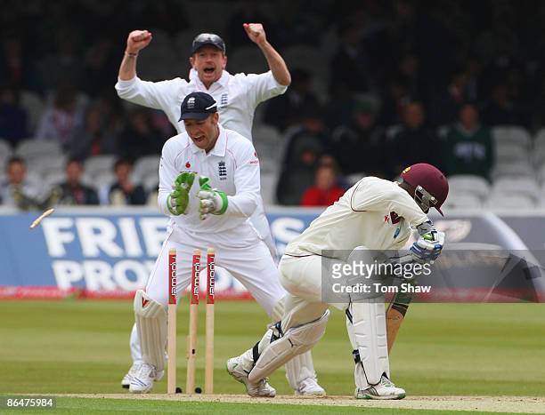 Devon Smith of West Indies is bowled by Graeme Swann of England as team mates Matt Prior and Paul Collingwood celebrate during day two of the 1st...
