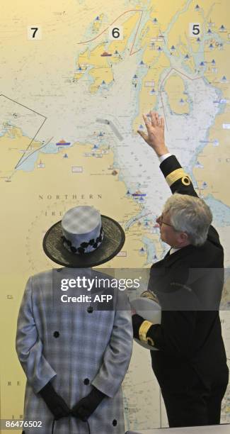 Britain's Queen Elizabeth II speaks with HM Coast Guard Sector Manager Brett Cunningham during her visit to the Coast Guard station headquarters in...