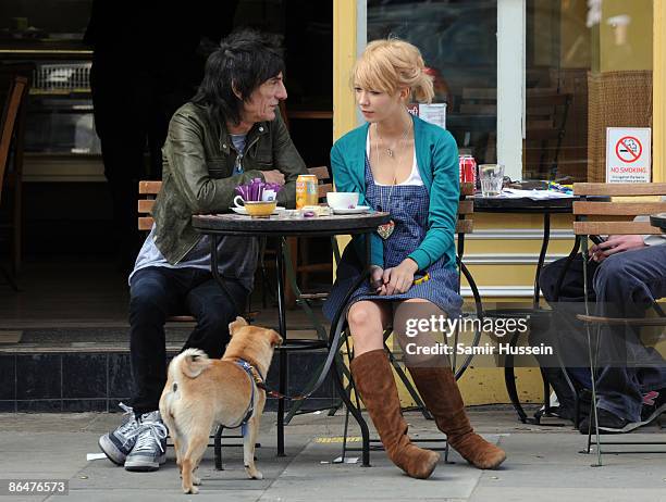 Ronnie Wood and girlfriend Ekaterina Ivanova enjoy the sunshine on April 21, 2009 in London, England.