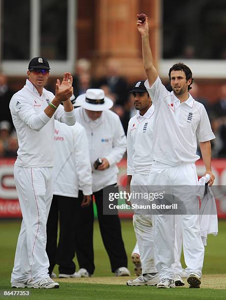 Graham Onions of England acknowledges his five wicket haul with Kevin Pietersen during day two of the 1st npower Test match between England and West...