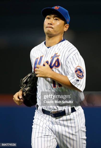 Norichika Aoki of the New York Mets runs off the field in the eighth inning of the first game of a double header against the Atlanta Braves at Citi...