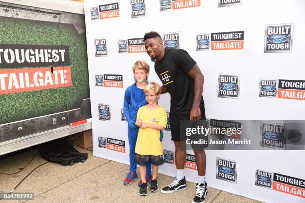 Steelers cornerback William Gay poses with fans during The Built Ford Tough toughest tailgate event on its fifth stop in Pittsburgh to Rev Up...