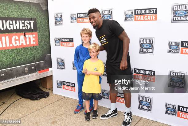 Steelers cornerback William Gay poses with fans during The Built Ford Tough toughest tailgate event on its fifth stop in Pittsburgh to Rev Up...