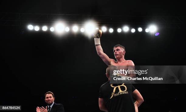 Ryan Burnett of Northern Ireland is declared the winner after his bout with Zhanat Zhakiyanov of Kazakhstan for the IBF, WBO and IBO World...