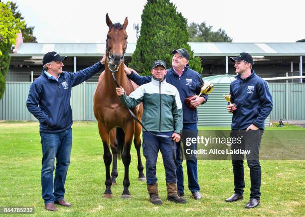 Tom Dabernig, David Hayes and Ben Hayes with Boom Time after winning the Caulfield Cup at Caulfield Racecourse on October 22, 2017 in Caulfield,...