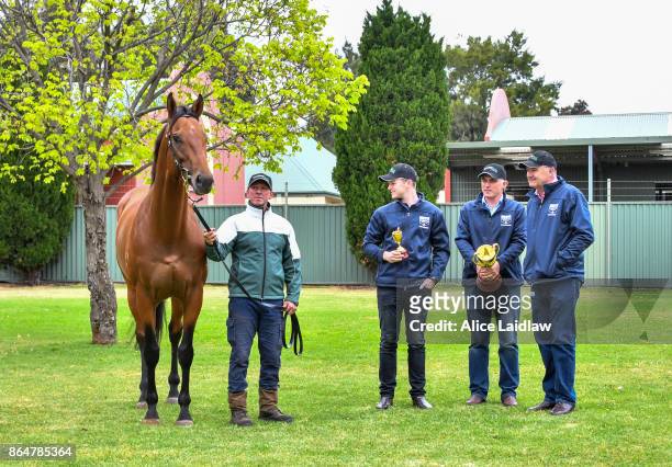 Tom Dabernig, David Hayes and Ben Hayes with Boom Time after winning the Caulfield Cup at Caulfield Racecourse on October 22, 2017 in Caulfield,...