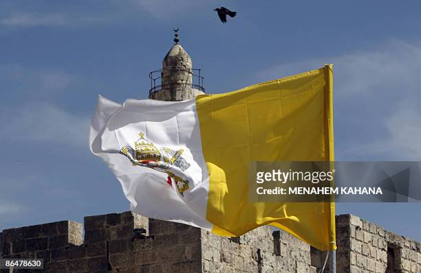 Vatican flag flutters near Jaffa Gate in the old city of Jerusalem on May 7, 2009 ahead of Pope Benedict XVI's visit to the Holy Land. Pope Benedict...