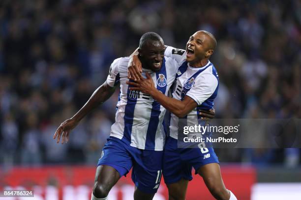 Porto's Malian forward Moussa Marega celebrates after scoring goal with teammate Porto's Algerian forward Yacine Brahimi during the Premier League...