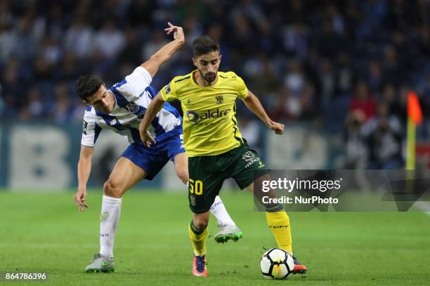 Porto's Spanish defender Ivan Marcano with Pacos Ferreira's Portuguese midfielder Antonio Xavier during the Premier League 2017/18 match between FC...