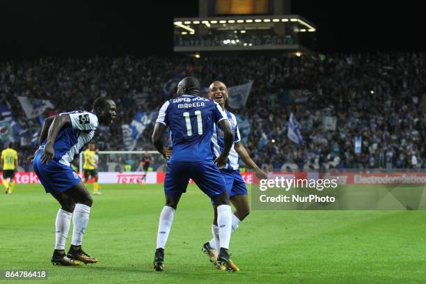 Porto's Malian forward Moussa Marega telebrates after scoring goal with teammates Porto's Cameroonian forward Vincent Aboubakar and Porto's Algerian...