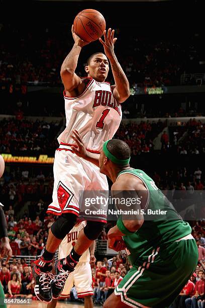 Derrick Rose of the Chicago Bulls goes up for a shot over Paul Pierce of the Boston Celtics in Game Six of the Eastern Conference Quarterfinals...