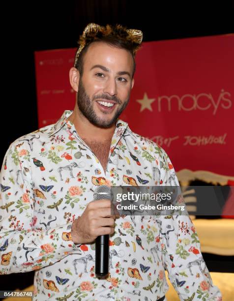 Television personality Micah Jesse speaks during an appearance by fashion designer Betsey Johnson at Macy's at the Fashion Show mall on October 21,...