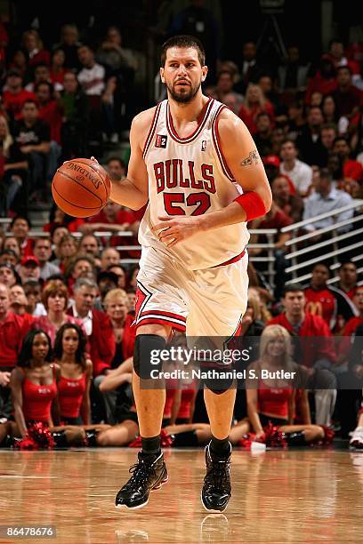 Brad Miller of the Chicago Bulls drives the ball up court in Game Six of the Eastern Conference Quarterfinals against the Boston Celtics during the...