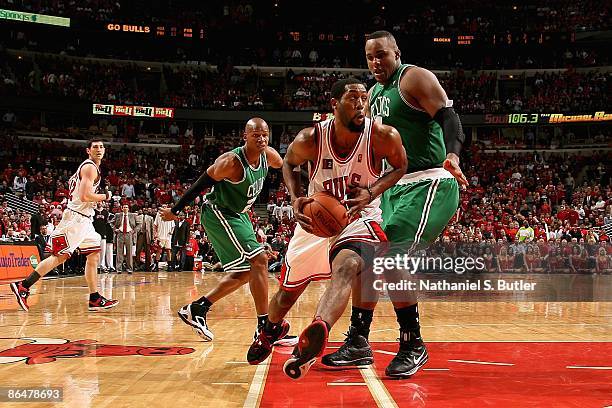 John Salmons of the Chicago Bulls drives past Glen Davis of the Boston Celtics in Game Six of the Eastern Conference Quarterfinals during the 2009...