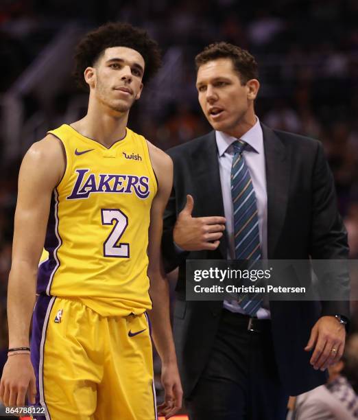 Lonzo Ball and head coach Luke Walton of the Los Angeles Lakers talk during the first half of the NBA game against the Phoenix Suns at Talking Stick...
