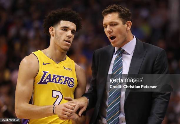 Lonzo Ball and head coach Luke Walton of the Los Angeles Lakers talk during the first half of the NBA game against the Phoenix Suns at Talking Stick...