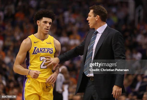 Lonzo Ball and head coach Luke Walton of the Los Angeles Lakers talk during the first half of the NBA game against the Phoenix Suns at Talking Stick...