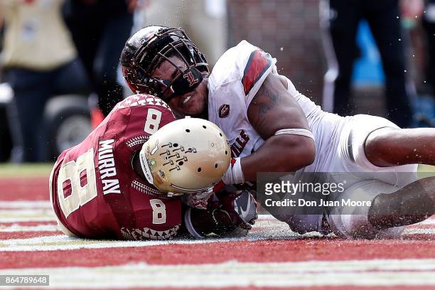 Wide Receiver Nyqwan Murray of the Florida State Seminoles recovers a loose ball for a score over Defensive End Trevon Young of the Louisville...