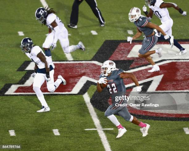 Running back Bilal Ally of the Massachusetts Minutemen runs in for a touchdown in the second half of the game against the Georgia Southern Eagles at...