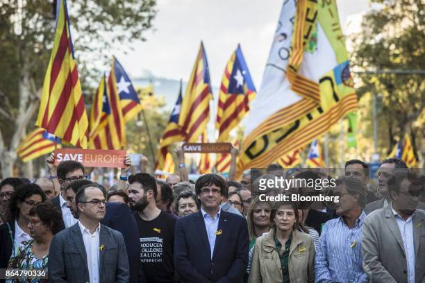 Carles Puigdemont, Catalonia's president, center, participates in a demonstration against the Spanish government and the imprisonment of separatist...