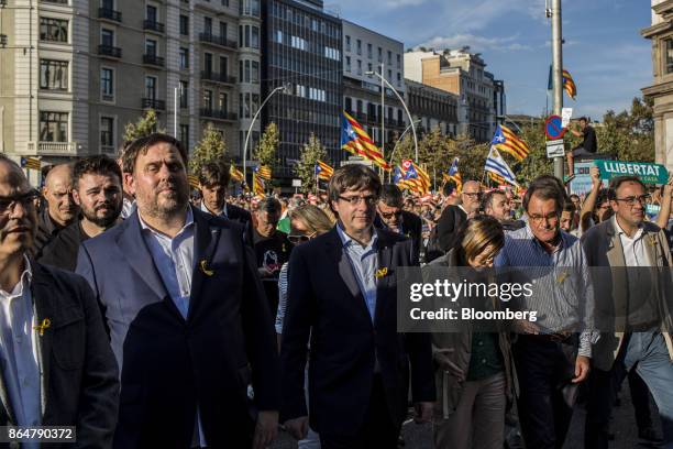 Carles Puigdemont, Catalonia's president, center, participates in a demonstration against the Spanish government and the imprisonment of separatist...