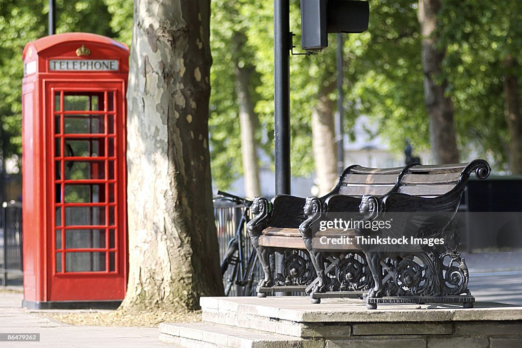 Telephone booth and park bench in London, England