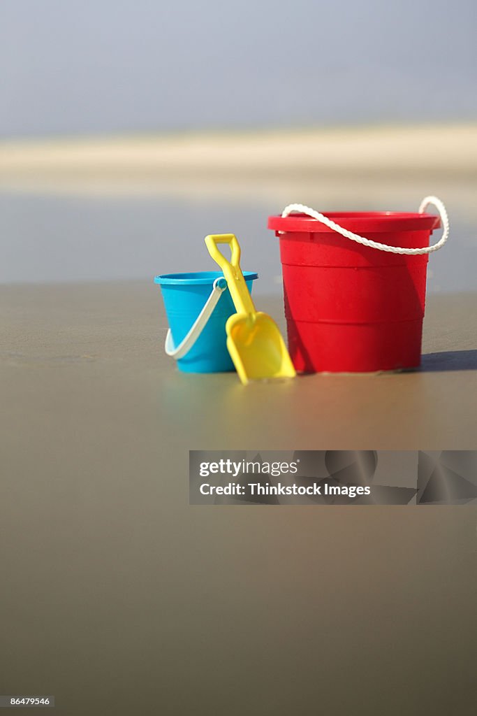 Pails and shovel on beach