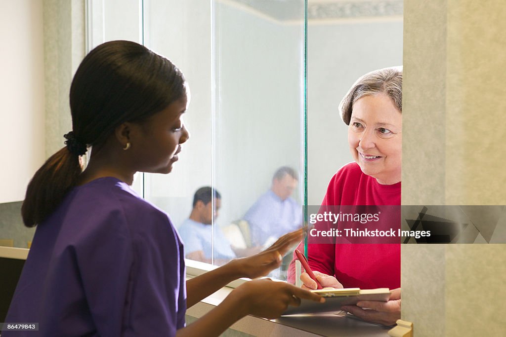 Woman checking in at counter