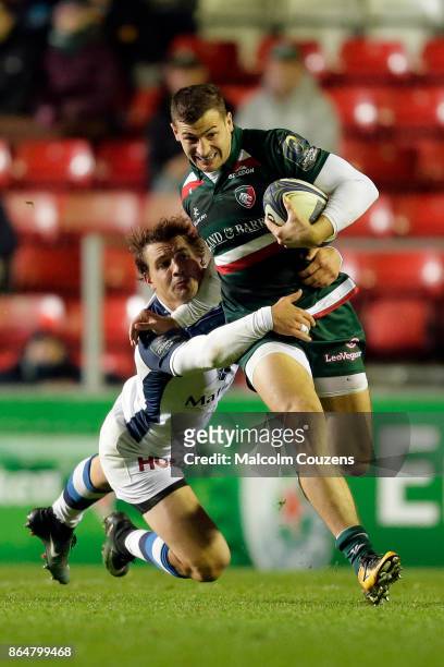 Jonny May of Leicester Tigers breaks away from Florian Viialelle of Castres during the European Rugby Champions Cup match between Leicester Tigers...