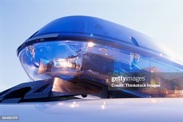 close-up of emergency lights on police car - police car lights stock pictures, royalty-free photos & images