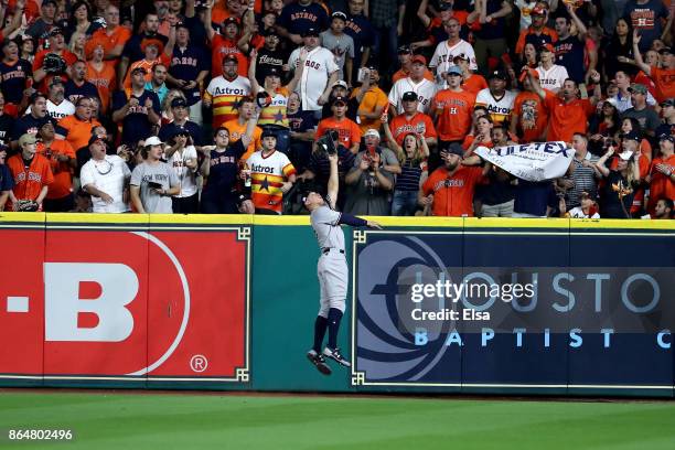 Aaron Judge of the New York Yankees catches a line drive in the outfield hit by Yuli Gurriel of the Houston Astros during the second inning in Game...