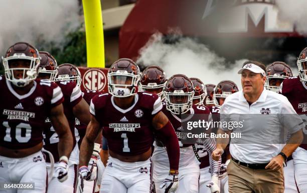 Head coach Dan Mullen of the Mississippi State Bulldogs takes the field with his team before the start of an NCAA football game against the Kentucky...