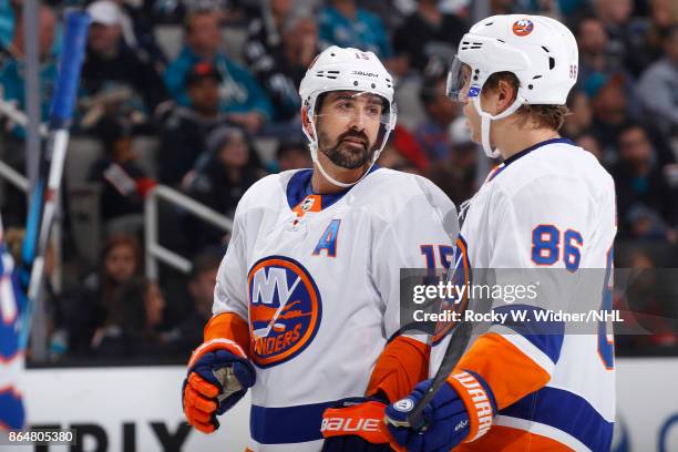 Cal Clutterbuck and Nikolay Kulemin of the New York Islanders talk during the game against the San Jose Sharks at SAP Center on October 14, 2017 in...