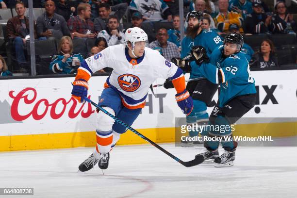 Nikolay Kulemin of the New York Islanders skates against Kevin Labanc of the San Jose Sharks at SAP Center on October 14, 2017 in San Jose,...